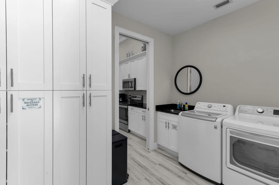 Spacious  laundry: full-size washer/dryer, sink, beach towels & laundry supplies