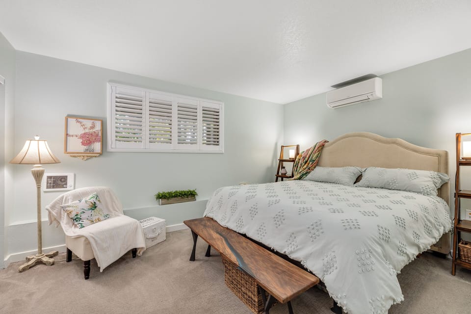 Primary bedroom with room darkening shutters and large closet space