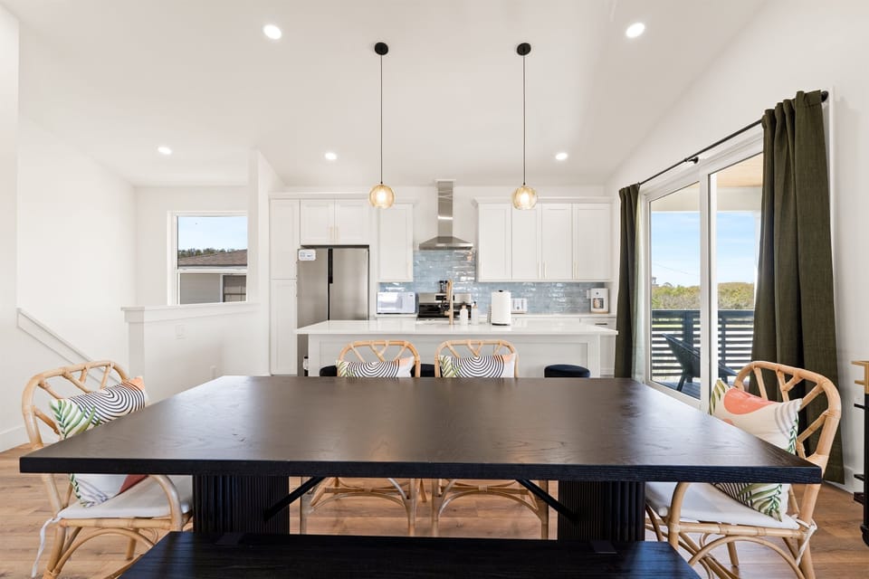 Open kitchen and living layout featuring modern finishes, spacious countertops, and sweeping views from every angle.