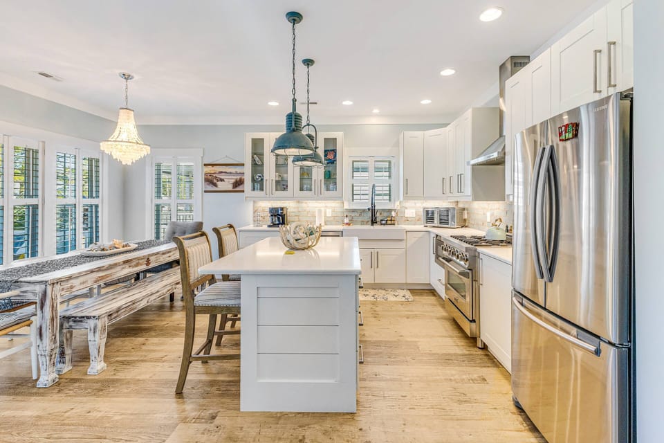 Kitchen featuring an island and all the equipment you need to cook.