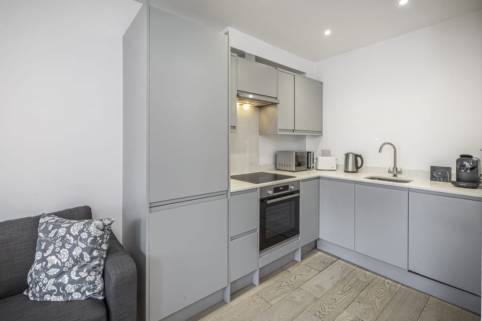 Prepare your favorite meals in this sleek, fully equipped kitchen at Stylish Bickley Home Near London. Modern convenience for your stay!