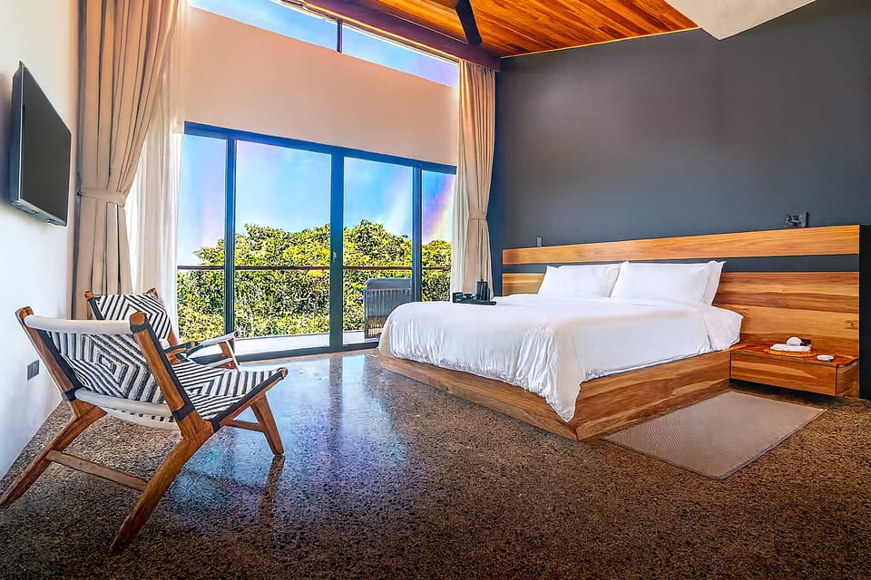Comfortable king bed, en suite full bathroom, walk in closet and private terrace