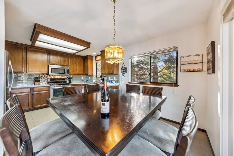 Cozy kitchen dining area with seating for eight, perfect for shared meals and easy gatherings.