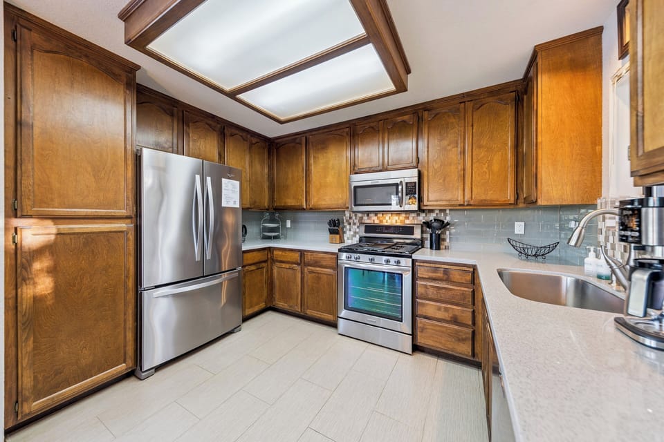 Updated kitchen with granite counters, stainless appliances, and all the essentials for easy family meals.
