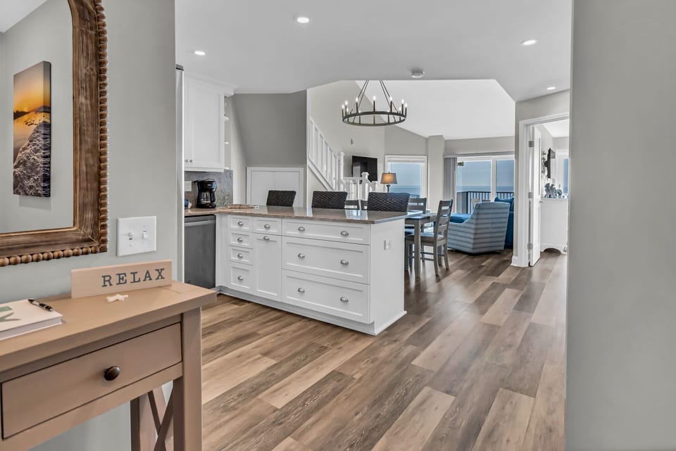 As you enter, you will enjoy the fully stocked kitchen and stunning ocean views.