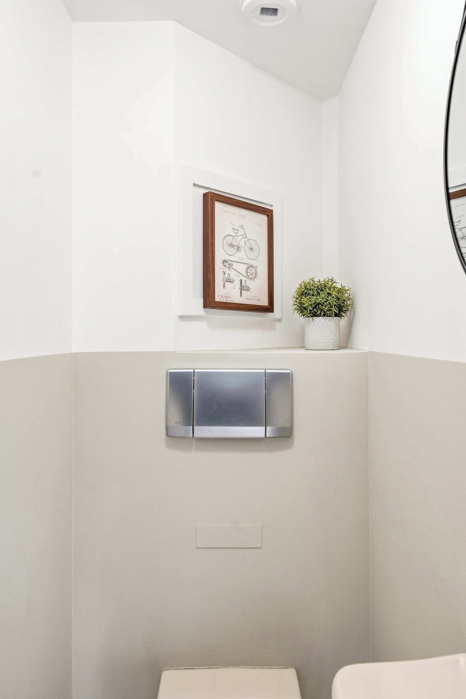 Bright guest toilet with curated decor — adding comfort and convenience for group stays or longer bookings.