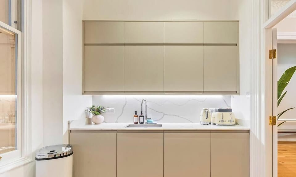 Light-filled kitchen with tall windows & premium appliances