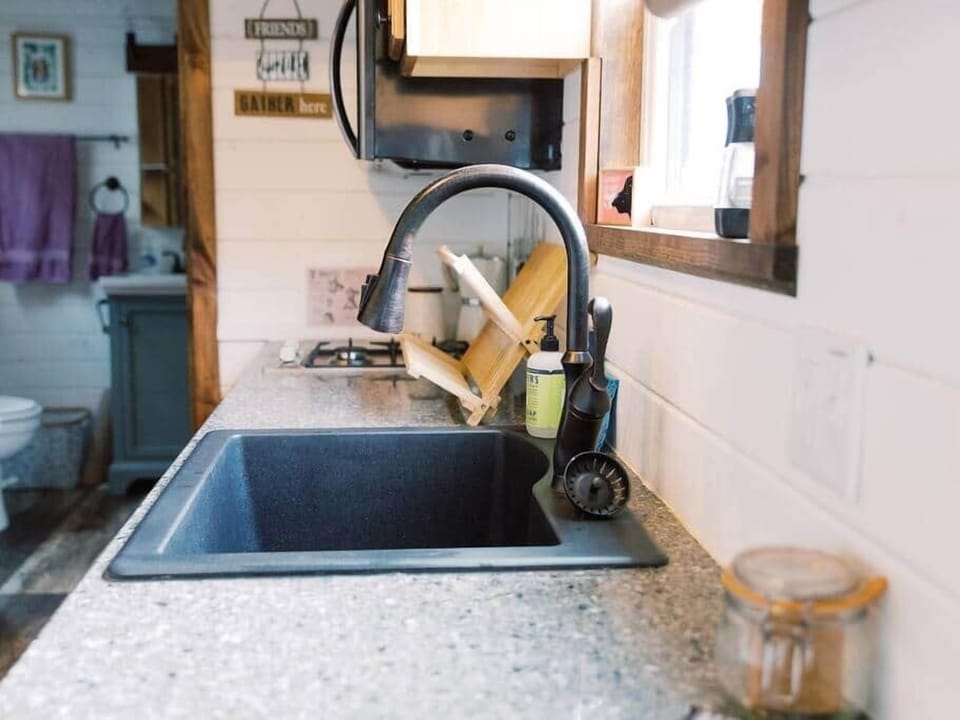 Full size fridge and sink -- two burners and a microwave, but note, no conventional oven.