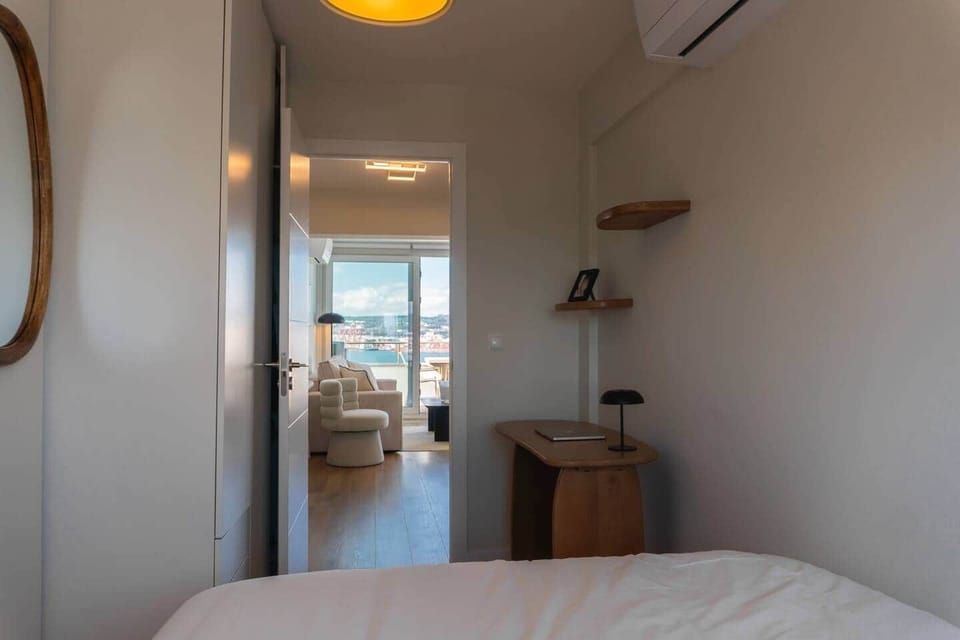 The full layout of the second bedroom, showing the dedicated workspace and bed.