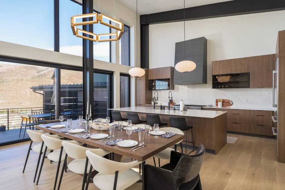 Open concept living space with floor to ceiling windows and effortless entertaining
