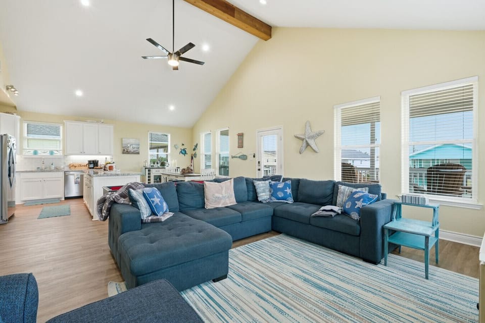 Living Room | Spacious Open-concept Layout with Vaulted Ceilings, Sectional Sofa, and Natural Light