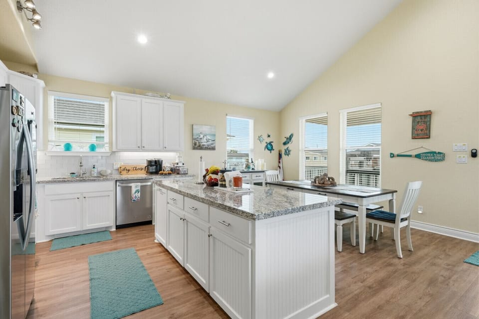 Kitchen | Modern Open-concept Kitchen with Granite Countertops, Stainless Steel Appliances, and Breakfast Bar Seating