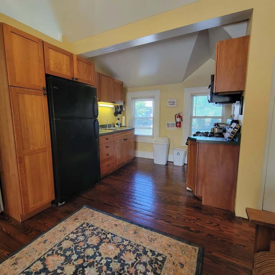 The carriage house has an open floor plan. The kitchen is just off the living room area and is fully stocked. 