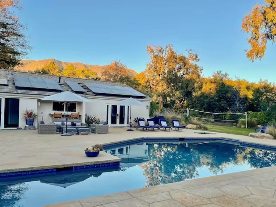 Large pool with a lap lane and mountain views.