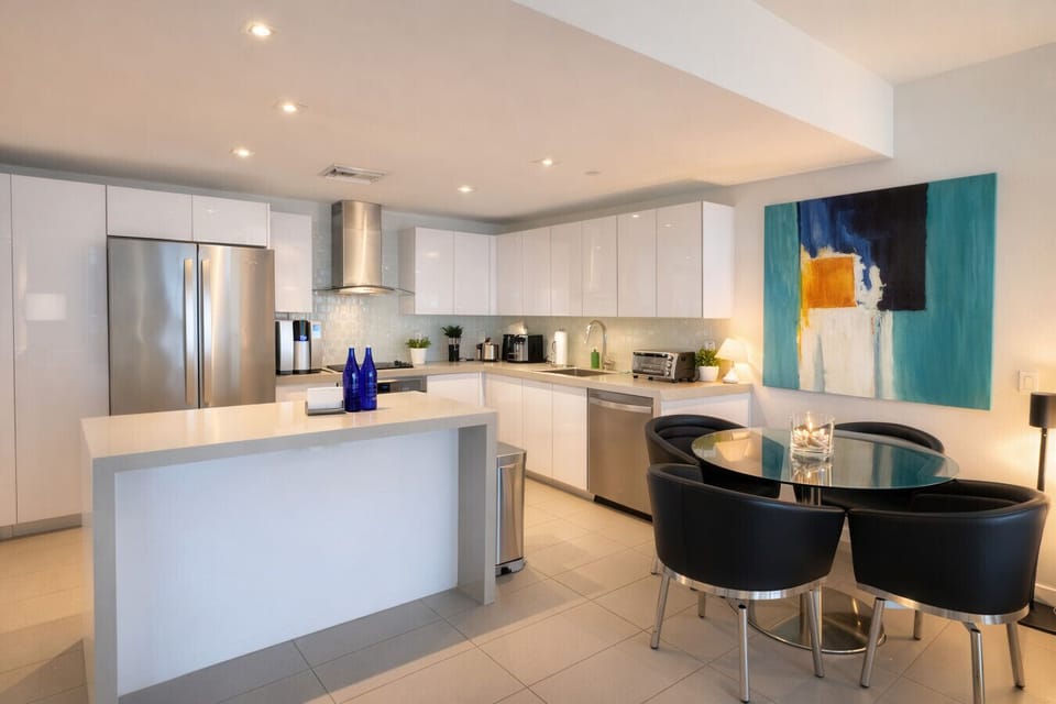 Stylish kitchen with modern appliances and a cozy dining nook.
