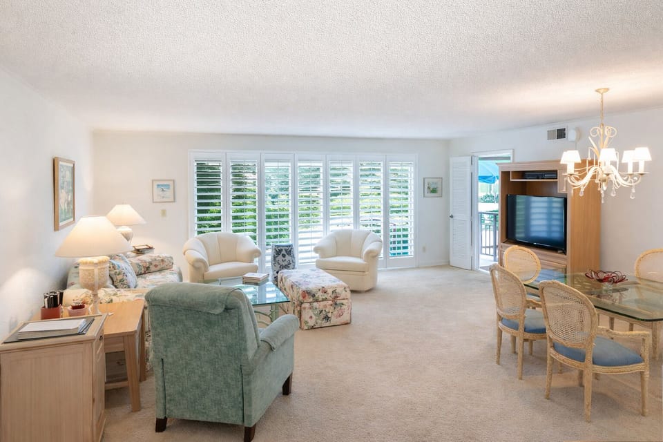 Living Area looking out to Patio, Pool, Jacuzzi, Grapefruit and Lemon Trees 
