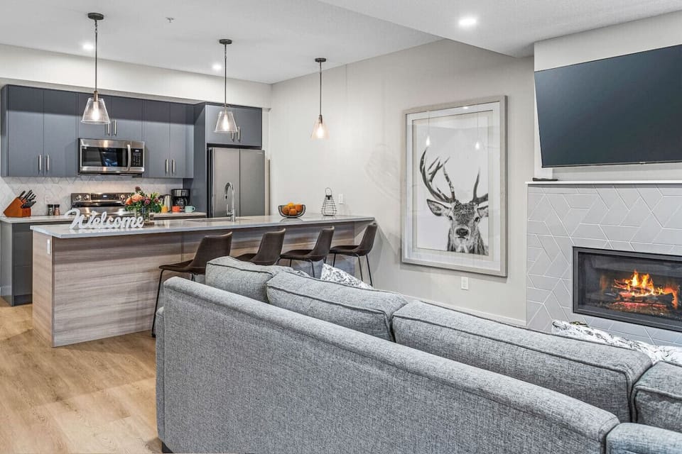 Open living room and kitchen with all essentials to have a wonderful stay.