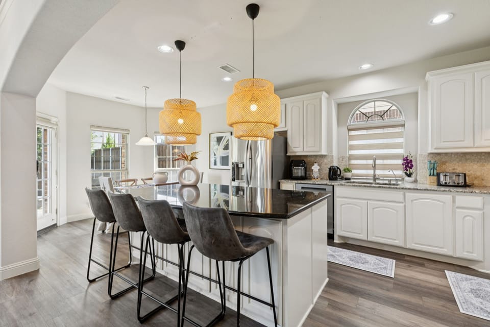 Gourmet Kitchen: Fully equipped with granite counters and stainless appliances.