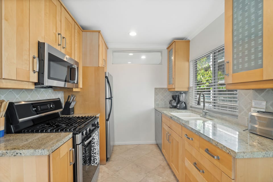 Cook up a storm in the fully stocked kitchen with new appliances