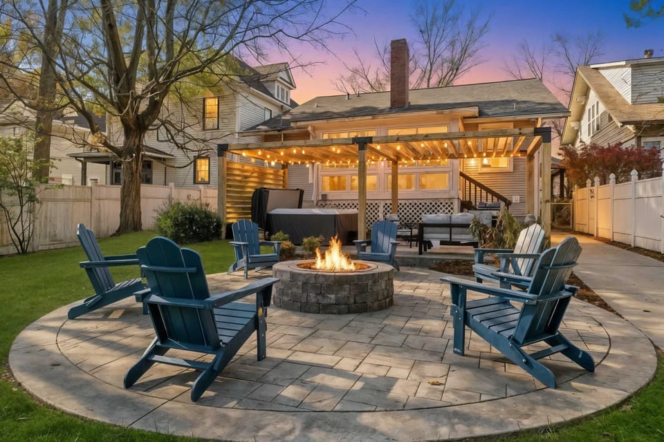 This outdoor space offers a cozy fire pit setup, a clear pathway, and a putting green, creating a great spot for conversation, games, and fresh-air moments.