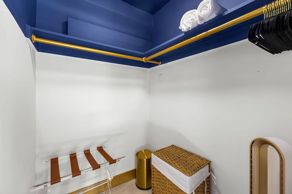 Closet with kids games, luggage stand, standing fan and more!