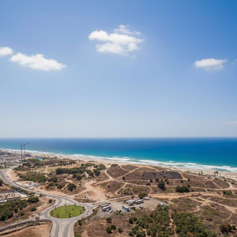 Endless horizon meets turquoise sea, delivering breathtaking coastal scenery visible from this elevated vantage point.