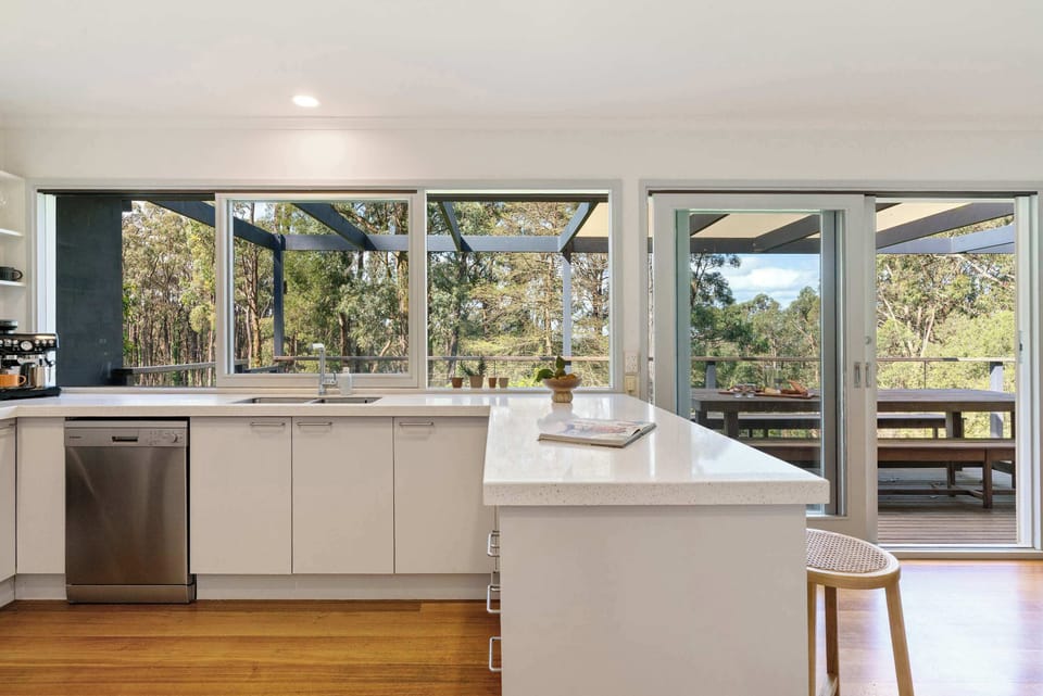 The kitchen servery window open to the deck, perfect for the fresh Red Hill breeze