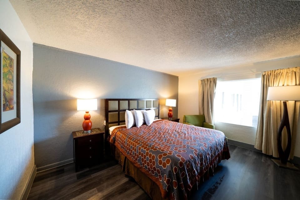 Relax in a bright, spacious room with soft bedside glow.