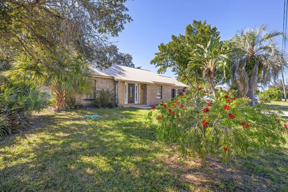 Beautiful front yard with palm trees and greenery