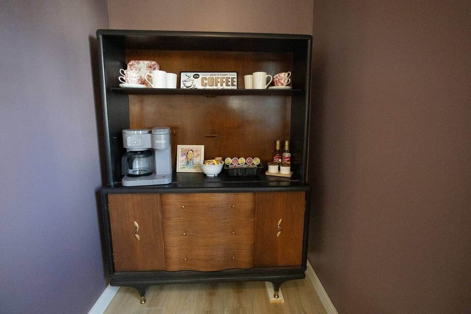 Enjoy your morning coffee at this charming coffee nook, complete with a Keurig machine, mugs, K-cups, and syrups. Thoughtful local touches make it the perfect start to your day.