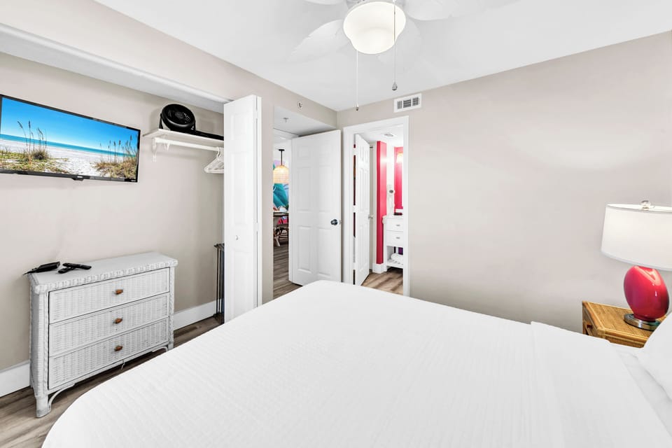 Your bright bedroom offers coastal charm with beach-inspired decor and modern comforts for restful nights.