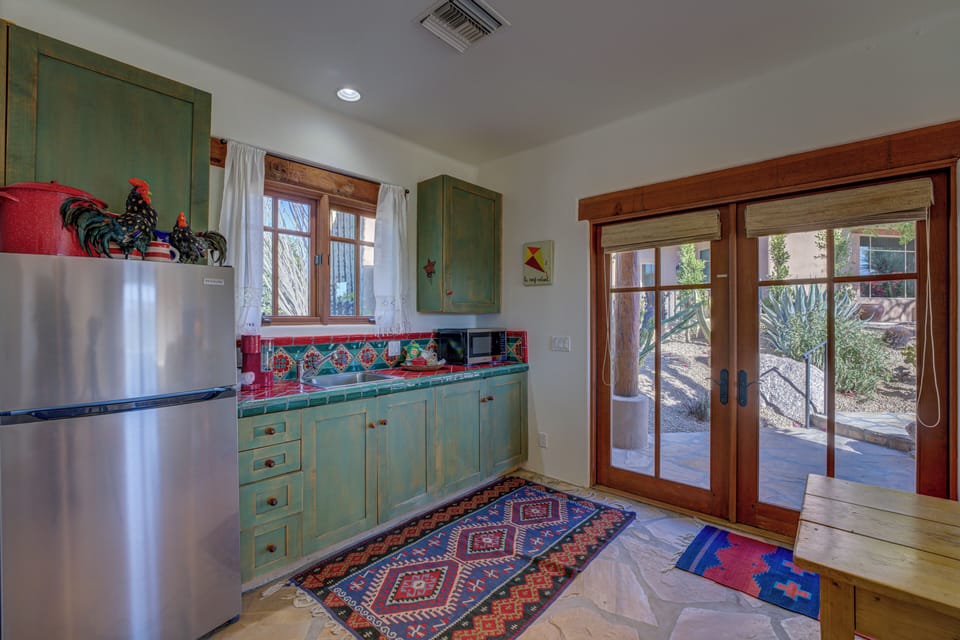There's a fridge/freezer, microwave, double-hot plate, BBQ, and coffee maker. 