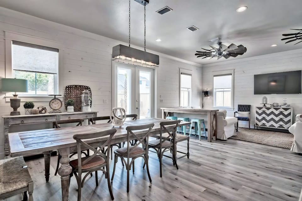 Enjoy seamless indoor-outdoor dining with a view of the pool.