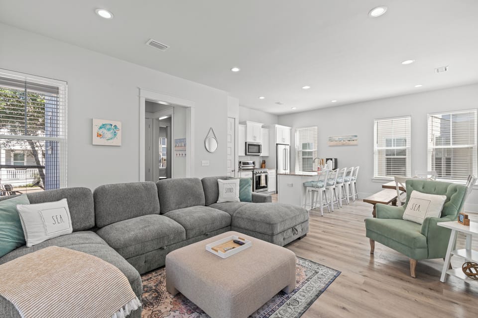 Relax in your bright, open living space with comfortable seating and a fully equipped kitchen perfect for your vacation stay.