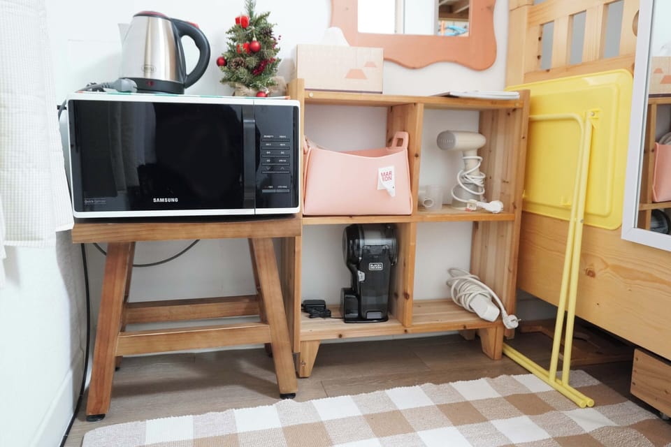 The black product in the middle of the picture is a small vacuum cleaner.