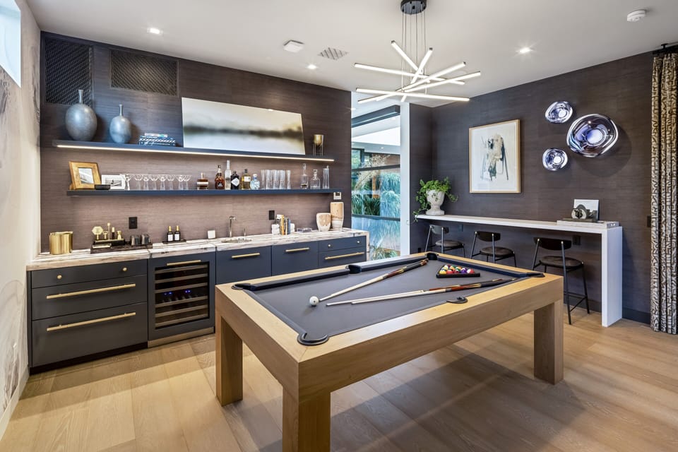 Spend quality time in the entertainment room, complete with billiards and a sleek bar for evening fun.