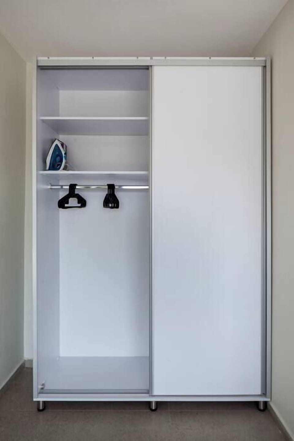 Wardrobe space keeps belongings organized, making extended stays comfortable and effortless.