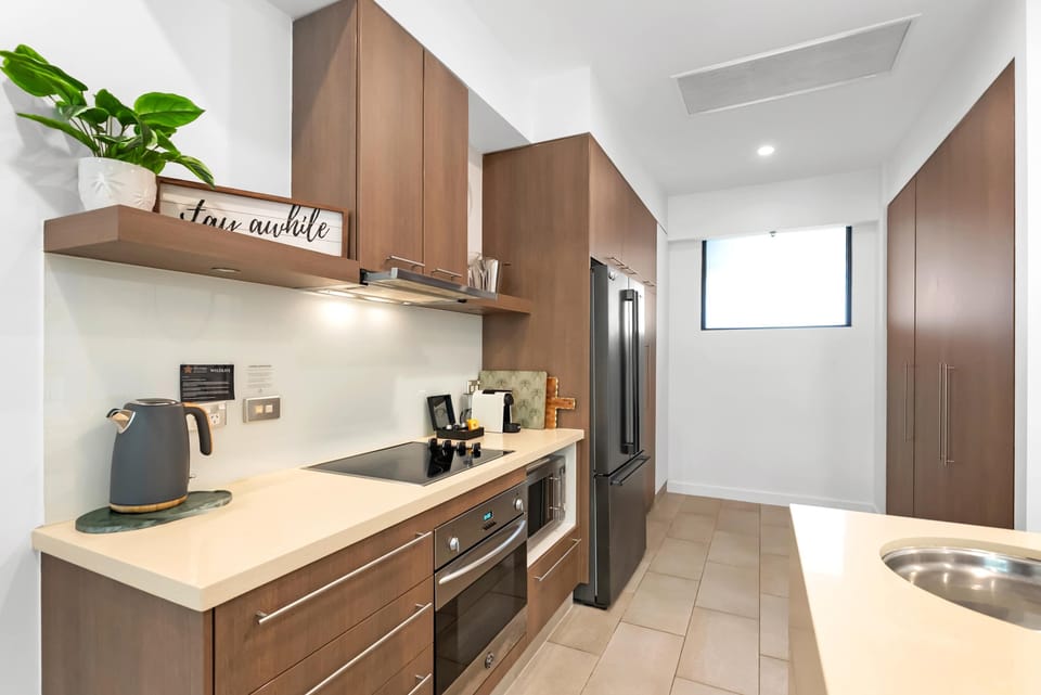 Prepare anything from poolside snacks to family dinners in the kitchen, with generous preparation space and a full suite of appliances making self-catering easy.