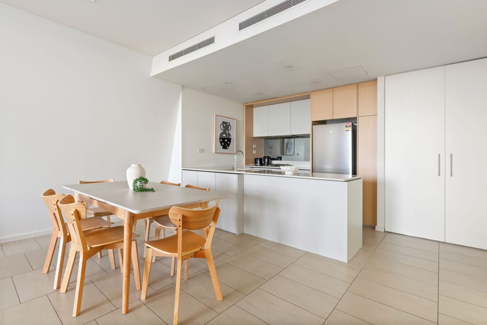 Gather around the six-seater dining table for shared meals and easy conversation.