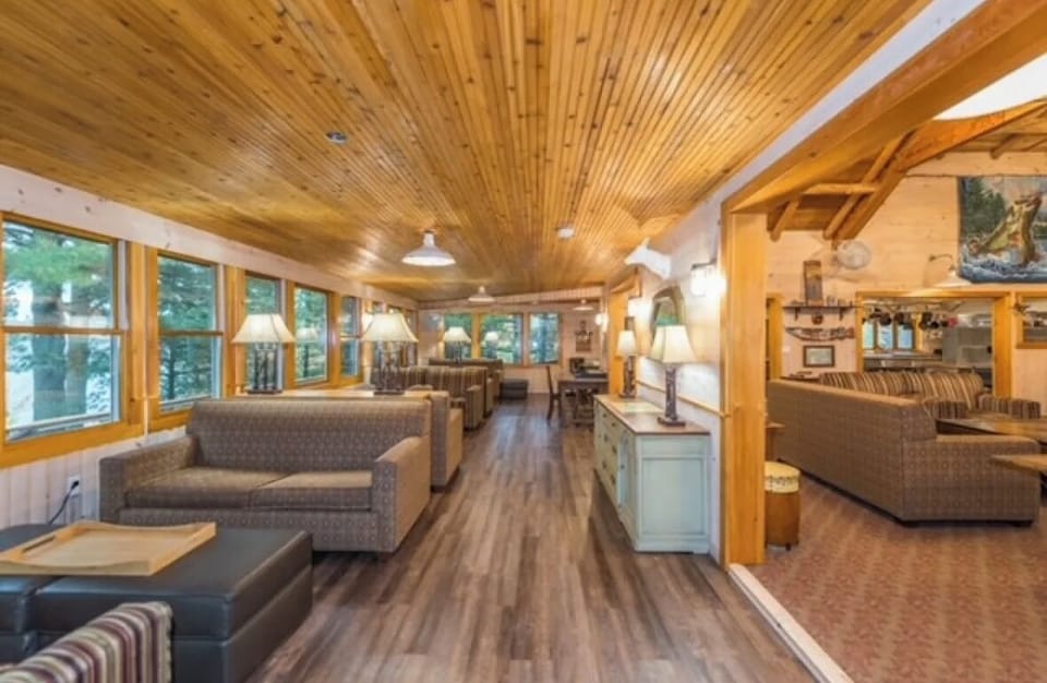 Sitting area with views to lake and TV in main lodge