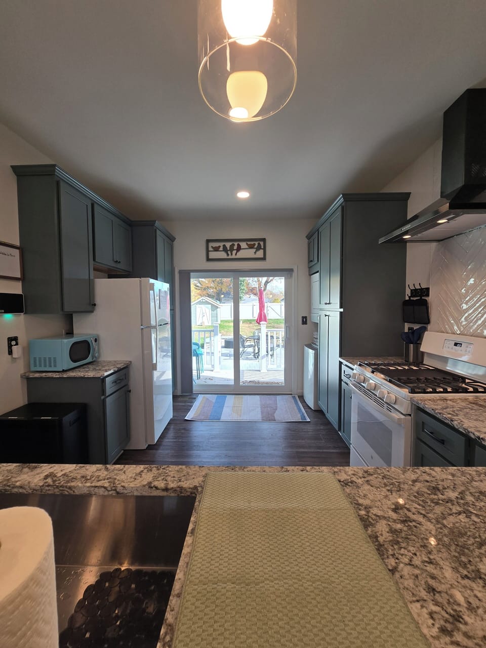 Kitchen with slider to back yard.