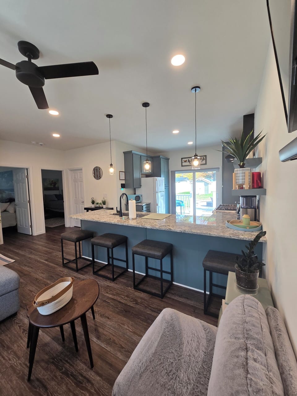 Open living room and kitchen with countertop dining.