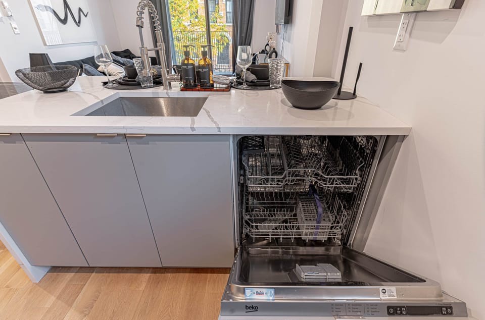 Energy-efficient dishwasher seamlessly integrated into cabinetry for effortless cleanup after meals