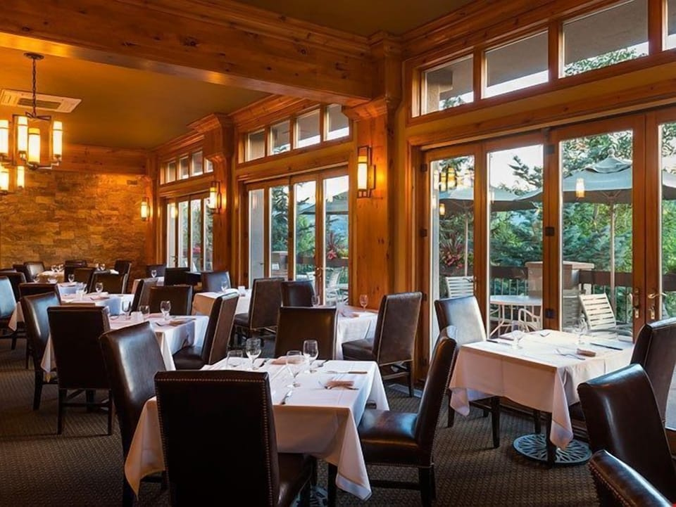 Savor exquisite moments amid cozy ambiance and warm wood finishes in this elegant dining space.