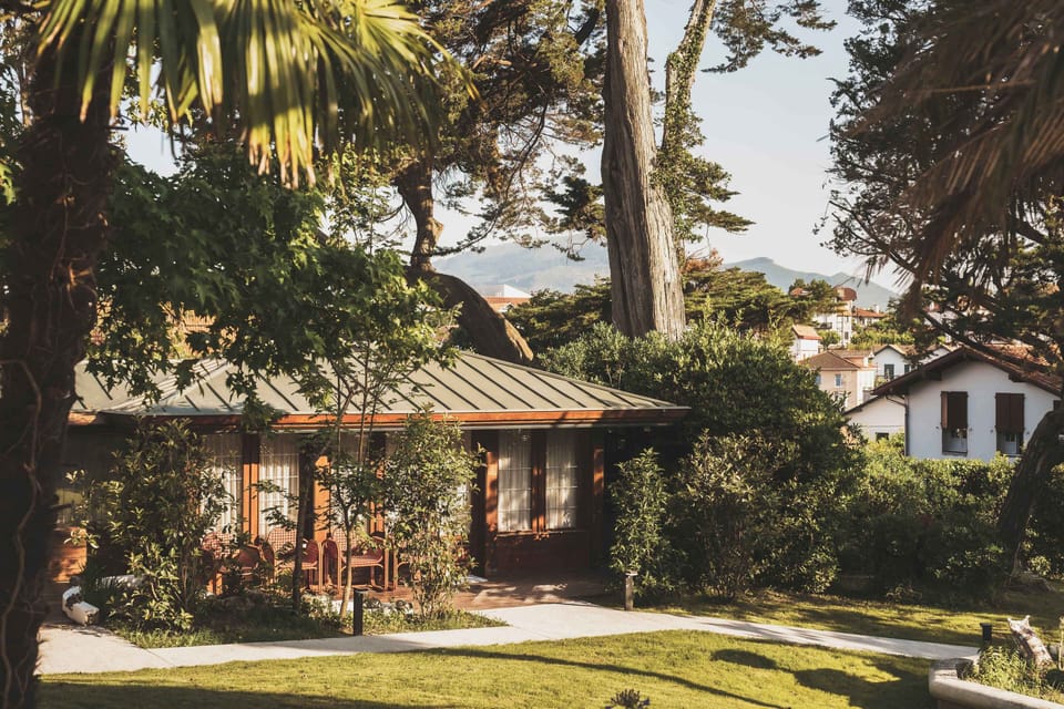 A peaceful haven surrounded by lush greenery and soft coastal light, offering timeless charm in the heart of Saint-Jean-de-Luz.