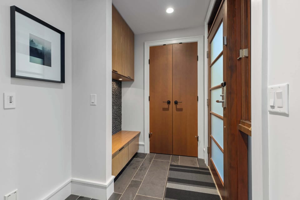 - Bright entry hallway with built in bench and storage nook  
- Modern tile flooring handles boots and gear with ease  
- Convenient layout keeps everything organized on arrival  
