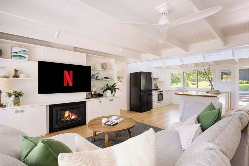 Open Plan Lounge Room with Fireplace and Smart TV