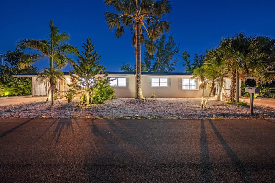Behold your entire Longboat Key compound illuminated by the twilight glow, ready to host your group vacation in style.