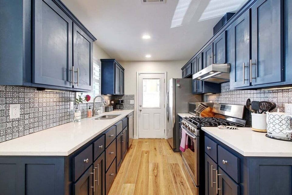 The kitchen is fully stocked with everything you need to prepare a meal including spices, pots, pans, and more!