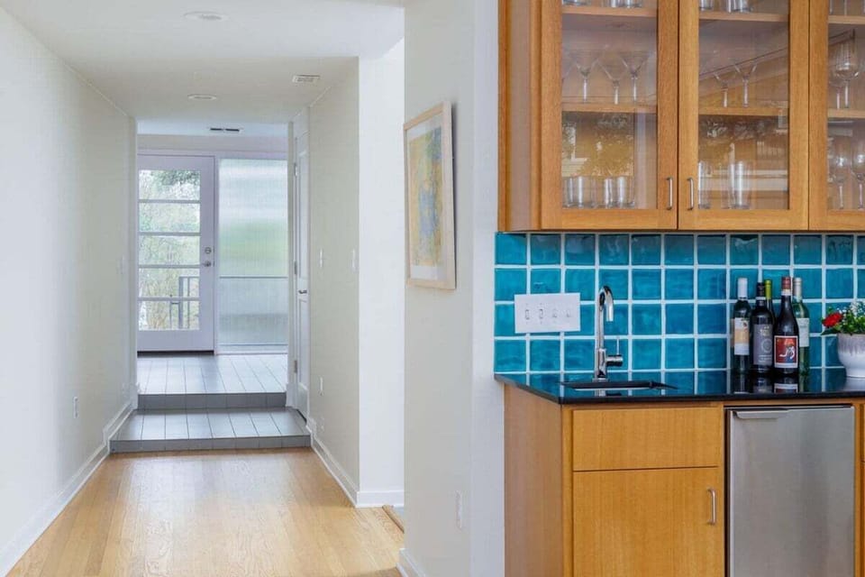 Wet bar leading to hallway